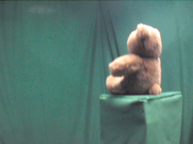 135 Degrees _ Picture 9 _ Brown Teddy Bear Wearing Red Bow.png